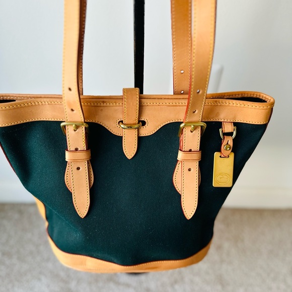 Dooney & Bourke Handbags - Dooney & Bourke
DOONEY & BOURKE VINTAGE CABRIOLET BUCKET BAG in Hunter Green